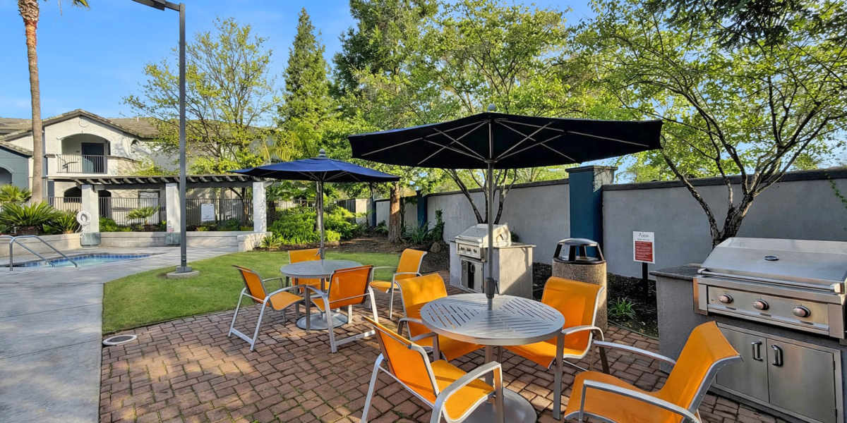 Barbeque area with outdoor dining space at Avion Apartments in Rancho Cordova, California