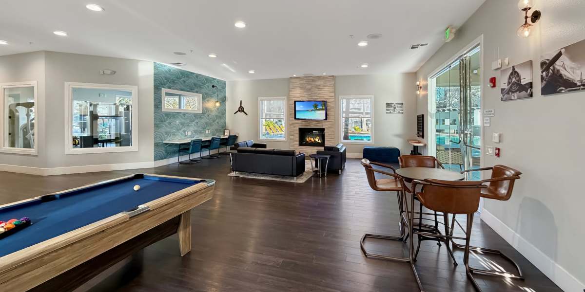 Upscale resident lounge with fireplace at Avion Apartments in Rancho Cordova, California