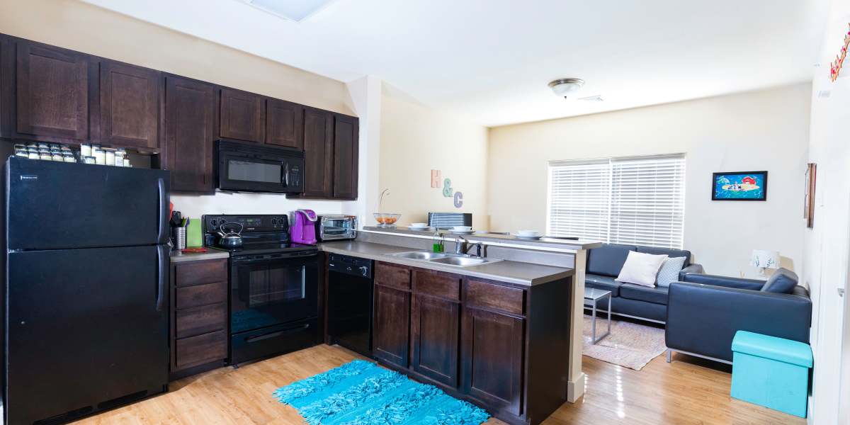 A kitchen with plenty of cabinet space at Beacon Springfield in Springfield, Missouri