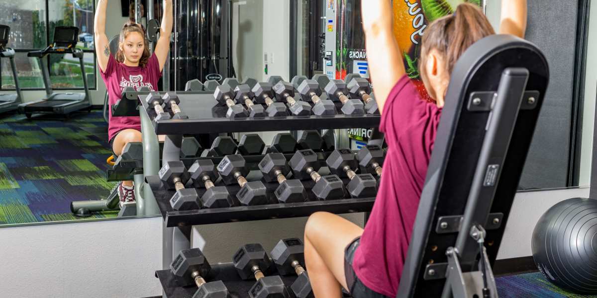 A fitness center with a weight rack at Beacon Springfield in Springfield, Missouri