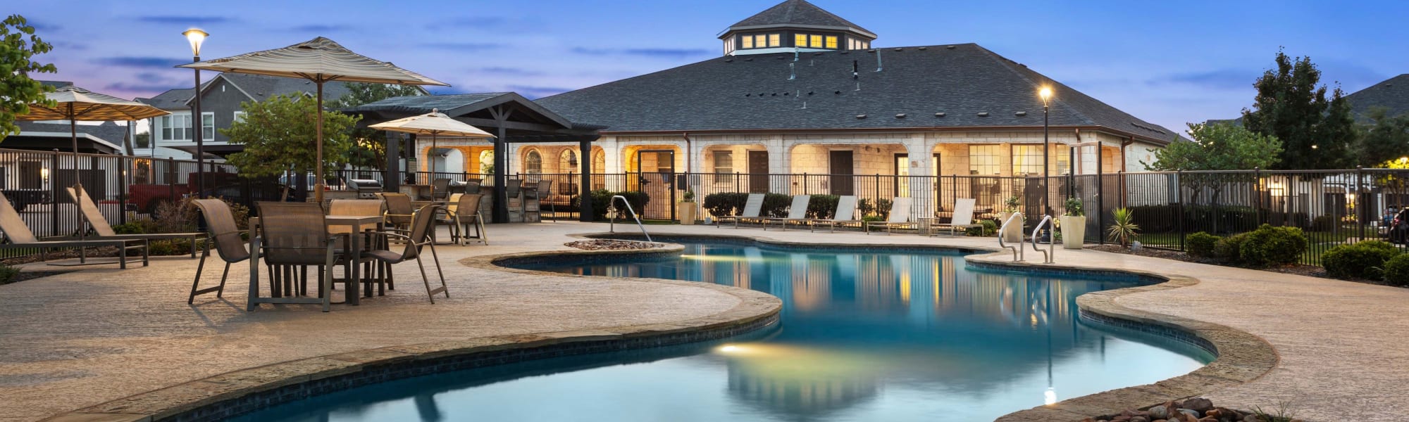 Resort type swimming pool at Olympus Woodbridge in Sachse, Texas