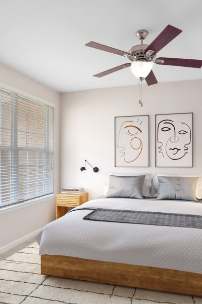 Cozy bedroom with a nice ceiling fan to keep you cool at Cantare at Indian Lake Village in Hendersonville, Tennessee