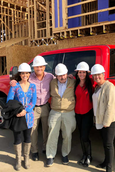 Team members in hard hats at SunRidge Management Group in Dallas, Texas