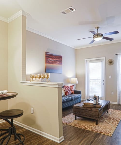 Bright and open apartment with wood-style floor at La Maison Of Saraland, Saraland, Alabama
