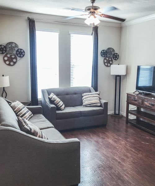 Model apartment with wood-style flooring at Le Rivage Luxury Apartments in Bossier City, Louisiana