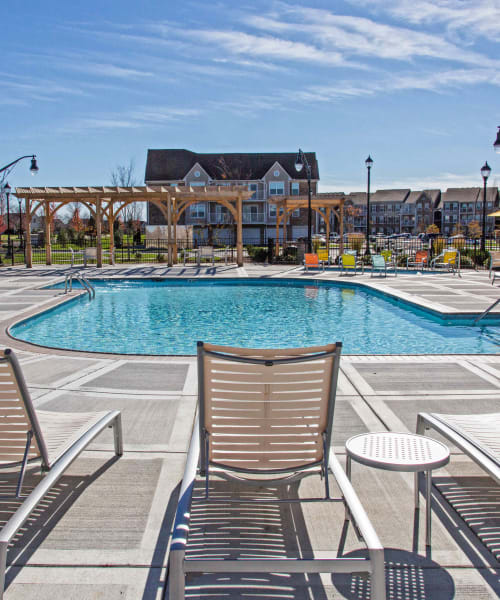 Sunny swimming pool and lounge chairs at Arbor Brook in Murfreesboro, Tennessee
