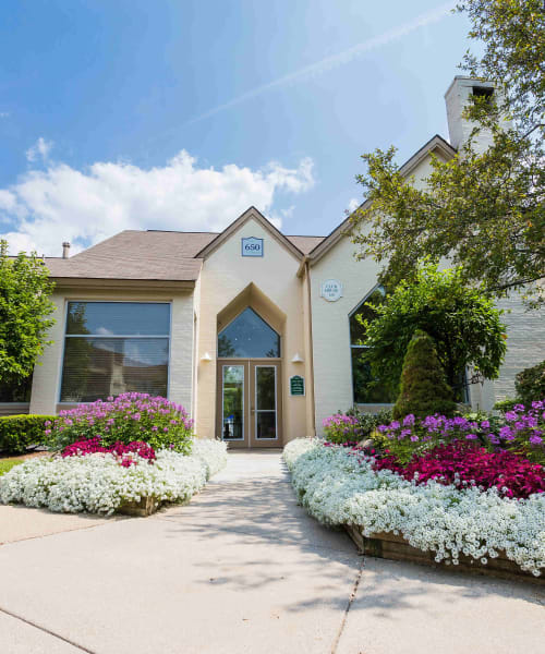 Beautiful flowerbeds lining the entrance to the resident clubhouse at Briar Cove Terrace Apartments in Ann Arbor, Michigan