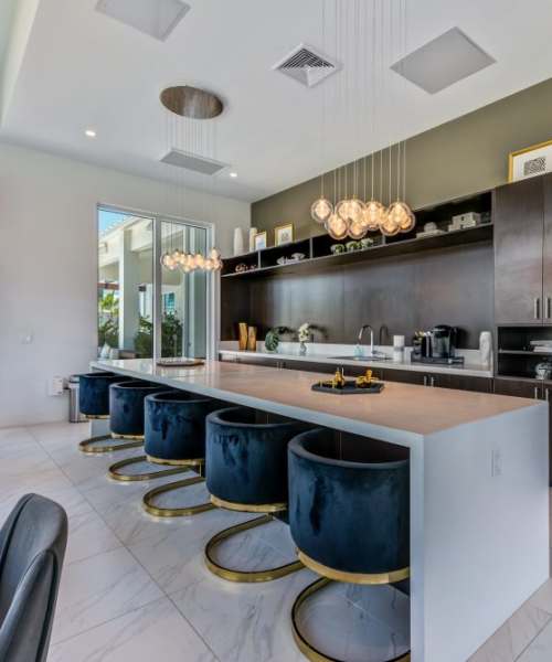 Kitchen with dinning space in the community clubhouse at Palm Beach Preserve in West Palm Beach, Florida