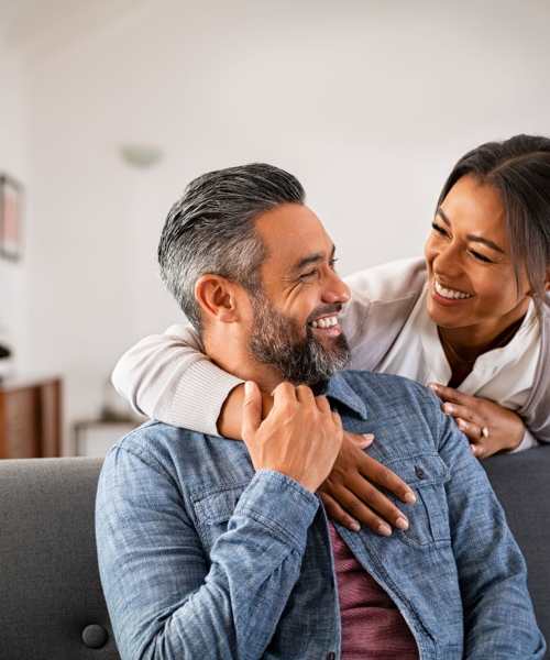 Two Residents Looking at Each Other and Smiling in an Apartment at 1221 Vallejo Apartments in Novato, California