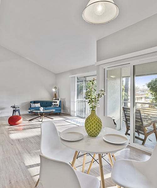 Dining table with giant windows in an apartment at Citra in Sunnyvale, California