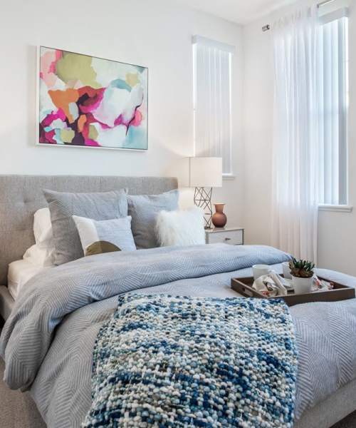 Cozy bedroom at Ageno Apartments in Livermore, California