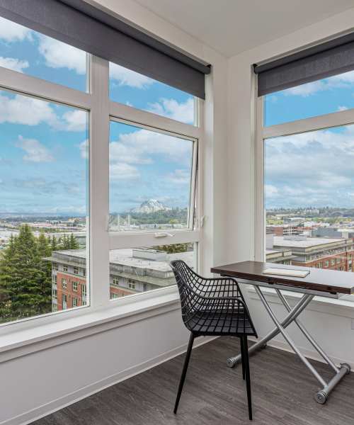 Dining table next to huge windows at Koz on Market in Tacoma, Washington