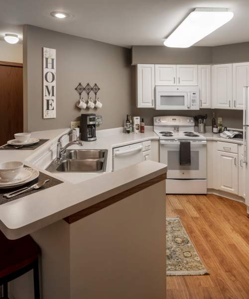 Kitchen with appliances at Deer Creek in Middleton, Wisconsin