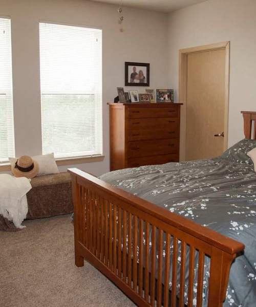 Comfortable bed at Hoff Mall and Hoff Apartments in Mount Horeb, Wisconsin