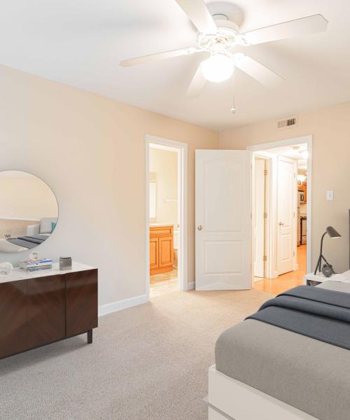 Apartment Bedroom with Ceiling Fan at Peachtree Apartments in Chesterfield, Missouri