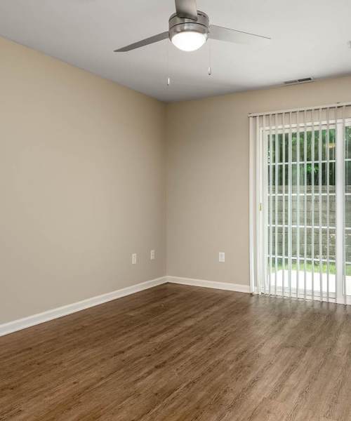 Spacious living area and private balcony at Labelle Greene III in Wheeling, West Virginia