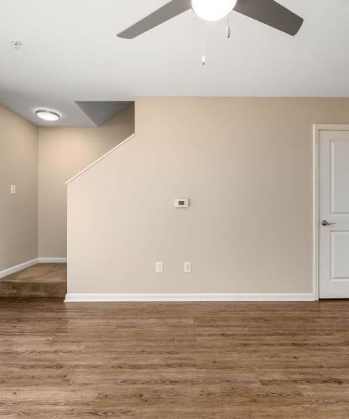 Spacious living room with ceiling fan at Labelle Greene III in Wheeling, West Virginia