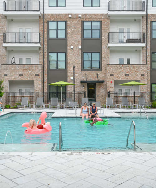 Residents relaxing in the swimming pool at The Heights at Waterpointe in Flowood, Mississippi