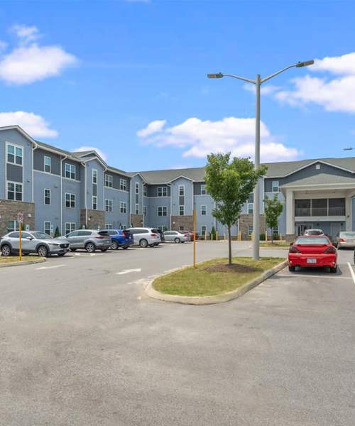 Modern building exterior with parking at Rooney Ridge in Roanoke Rapids, North Carolina