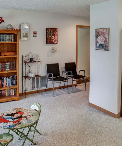 Cozy seating area with decorative table at Riverview Place in Ripley, Ohio