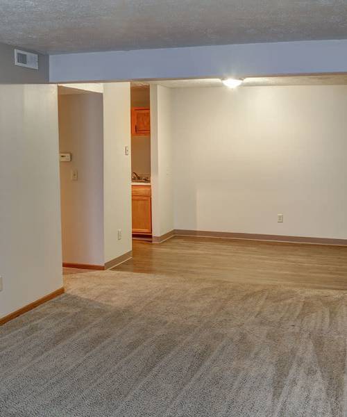 Spacious living area with wood-style flooring at Riverview Place in Ripley, Ohio
