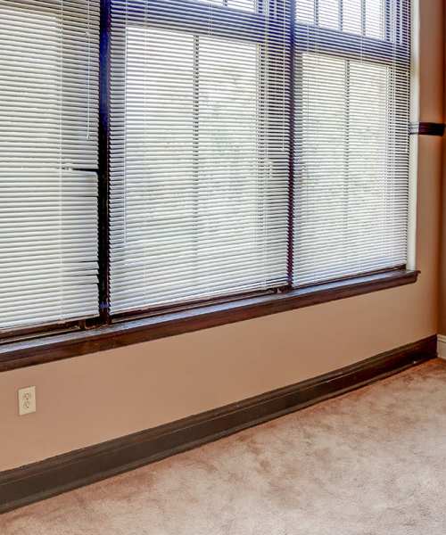 Carpeted floor with large windows at Washington School Apartments in Washington Court House, Ohio