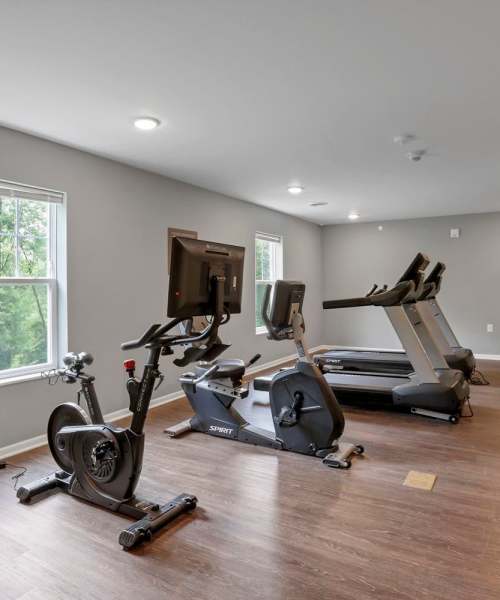 Modern fitness center with wood-style flooring at Wendler Commons in Columbus, Ohio