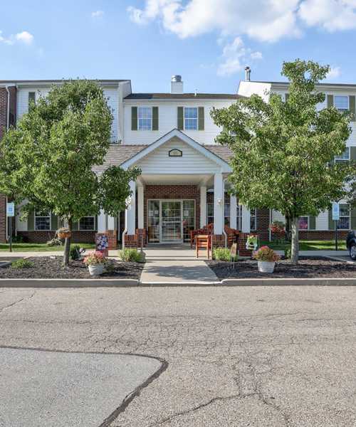 Welcoming entrance with landscaped planters at Meridian Greene I in Wintersville, Ohio