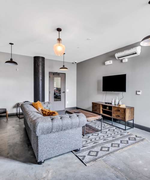 Spacious living room with a TV at Prospect Yard in Cleveland, Ohio 
