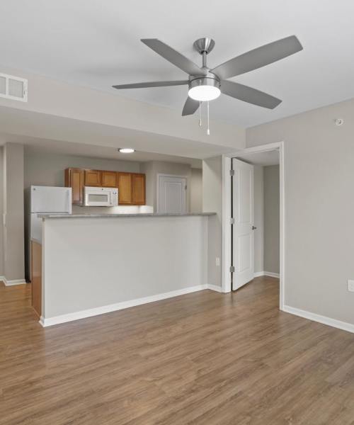View of the kitchen and living room with proper air conditioning at Dunbury Greene in Columbus, Ohio