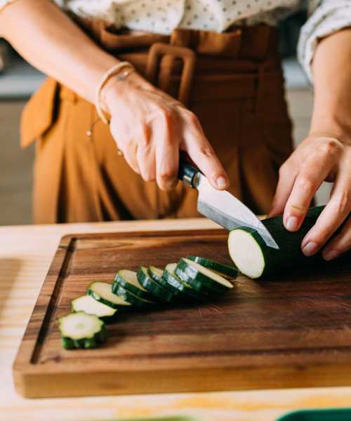 Resident chopping vegetables at The Baxter at Westwood in Austin, Texas