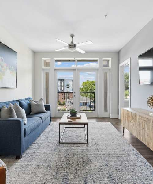 Spacious open living area with balcony at Overton Row in Charlotte, North Carolina