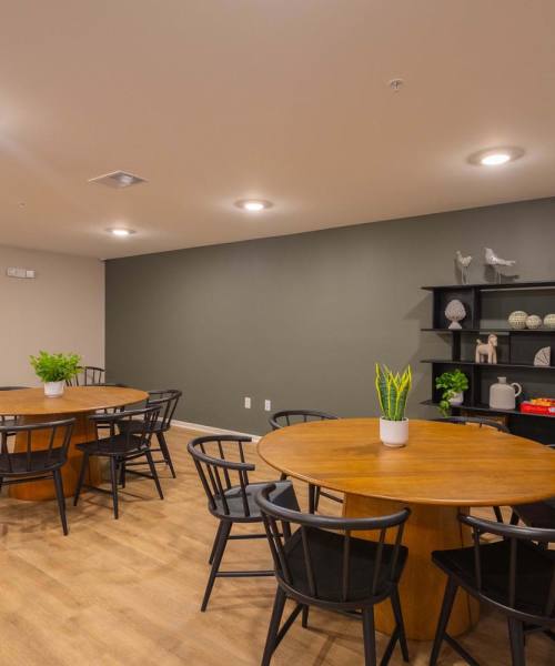 Wood-style flooring in modern community lounge at Juniper Crossing II in Columbus, Ohio