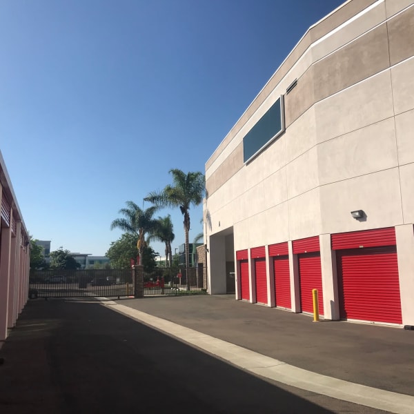 Outdoor storage units with bright doors at StorQuest Self Storage in Carlsbad, California