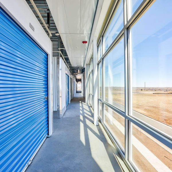 Indoor units with blue doors at StorQuest Self Storage in Arvada, Colorado