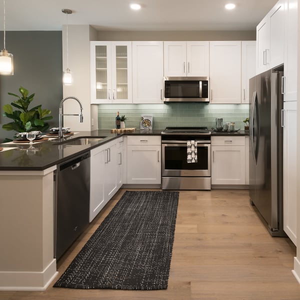 Gourmet kitchen with stainless-steel appliances at The Halsten at Chauncey Lane in Scottsdale, Arizona