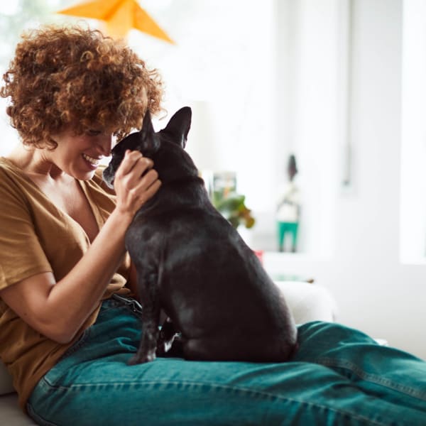 Resident and her puppy in their new home at El Potrero Apartments in Bakersfield, California