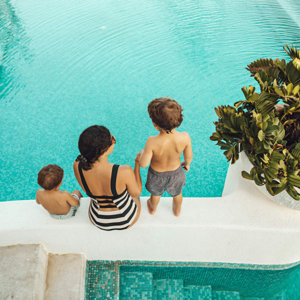 Resident family about to take a dip in the pool at El Potrero Apartments in Bakersfield, California