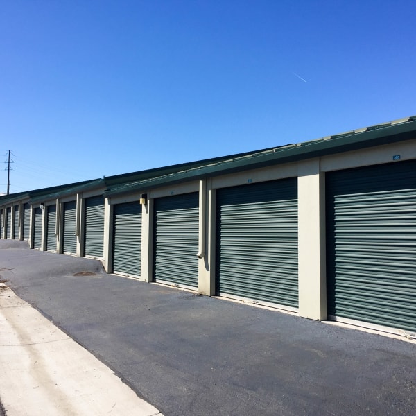 Outdoor storage units with green doors at StorQuest Self Storage in Golden, Colorado