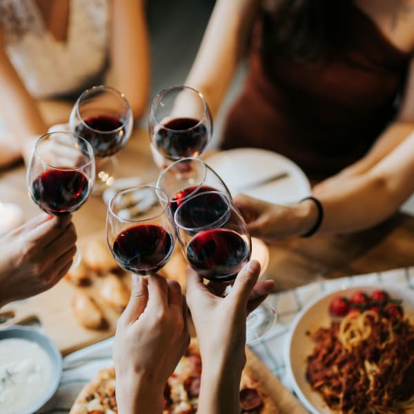 Friends enjoying wine and dinner near The Buckler in Milwaukee, Wisconsin