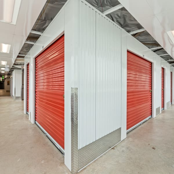 Indoor storage units with bright doors at StorQuest Self Storage in Los Angeles, California