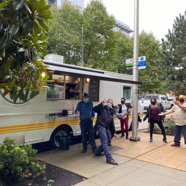 Resident getting food from a food truck near The Century in Seattle, Washington