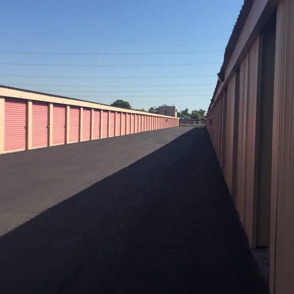 Outdoor storage units with bright doors at StorQuest Self Storage in Glendale, Arizona