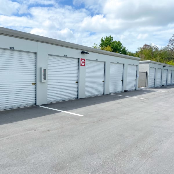 Indoor storage units with bright doors at StorQuest Self Storage in Tarpon Springs, Florida