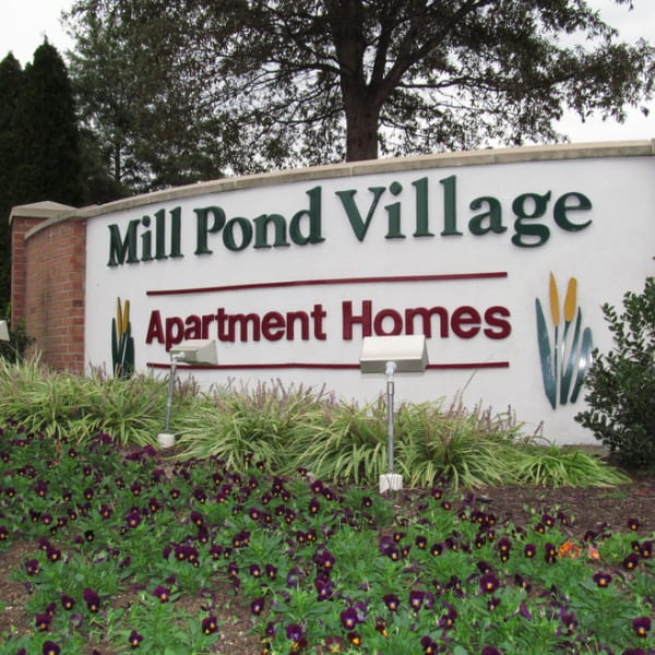 Exterior welcoming sign at Mill Pond Village Apartments in Salisbury, Maryland