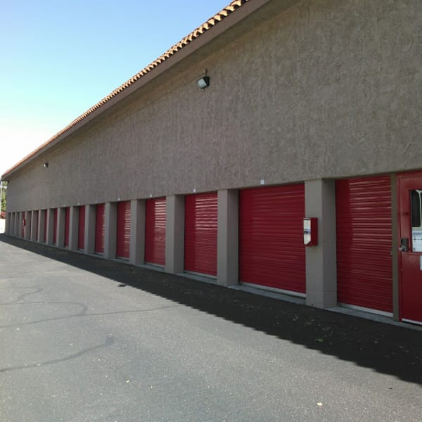 Outdoor storage units with red doors at StorQuest Express Self Service Storage in Mesa, Arizona