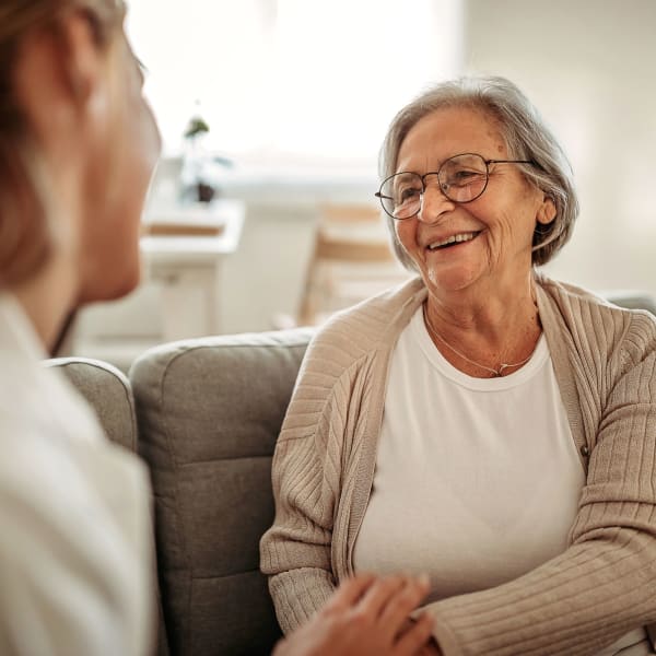 Resident being assisted at Avila Senior Living at Downtown SLO in San Luis Obispo, California