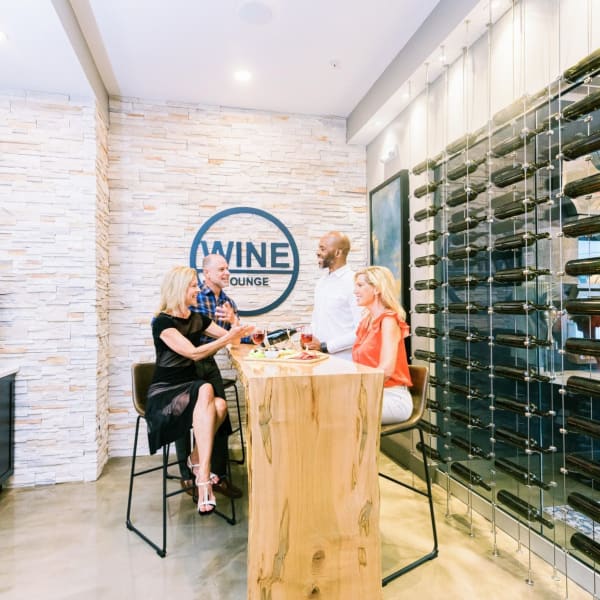 Residents sitting down in the wine lounge at Carroll at Bellemeade in Greensboro, North Carolina