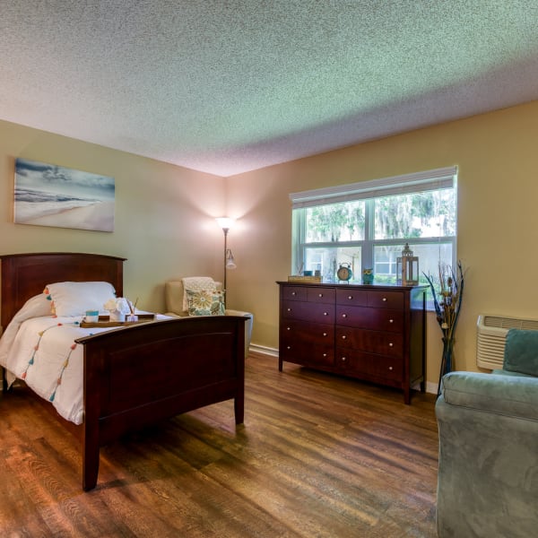 Model bedroom with hard-wood flooring at Wyndham Lakes in Jacksonville, Florida