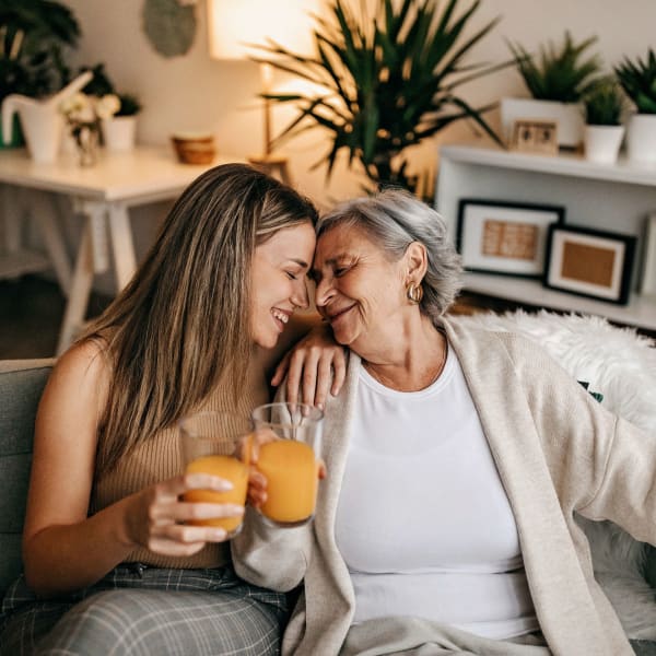 Resident and her daughter hugging at Pacifica Senior Living Encinitas in Encinitas, California